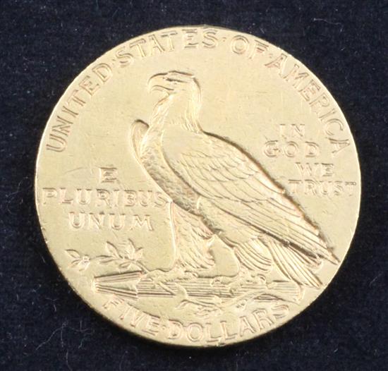 A United States 1911 $5 gold coin,